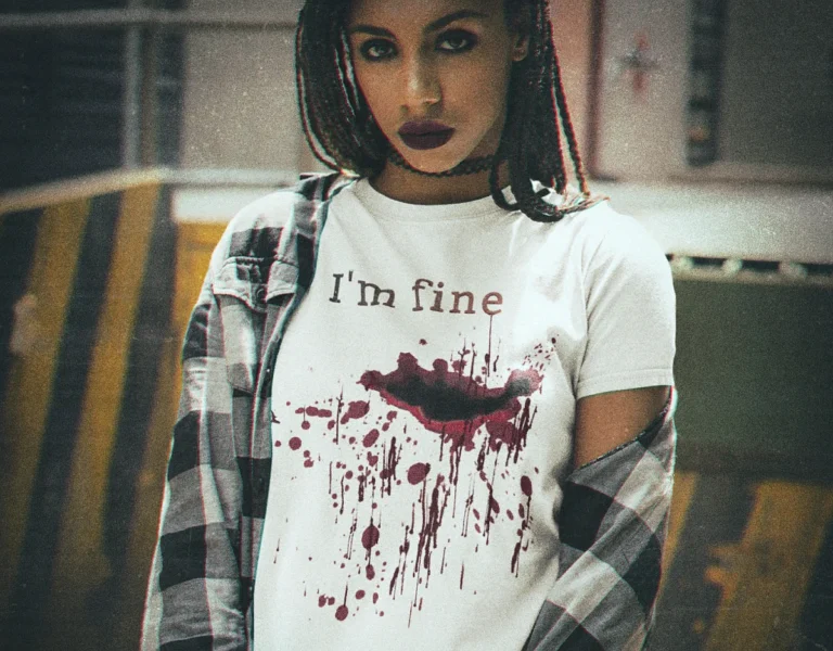 Woman wearing an I am fine bloody t shirt with blood splatter design